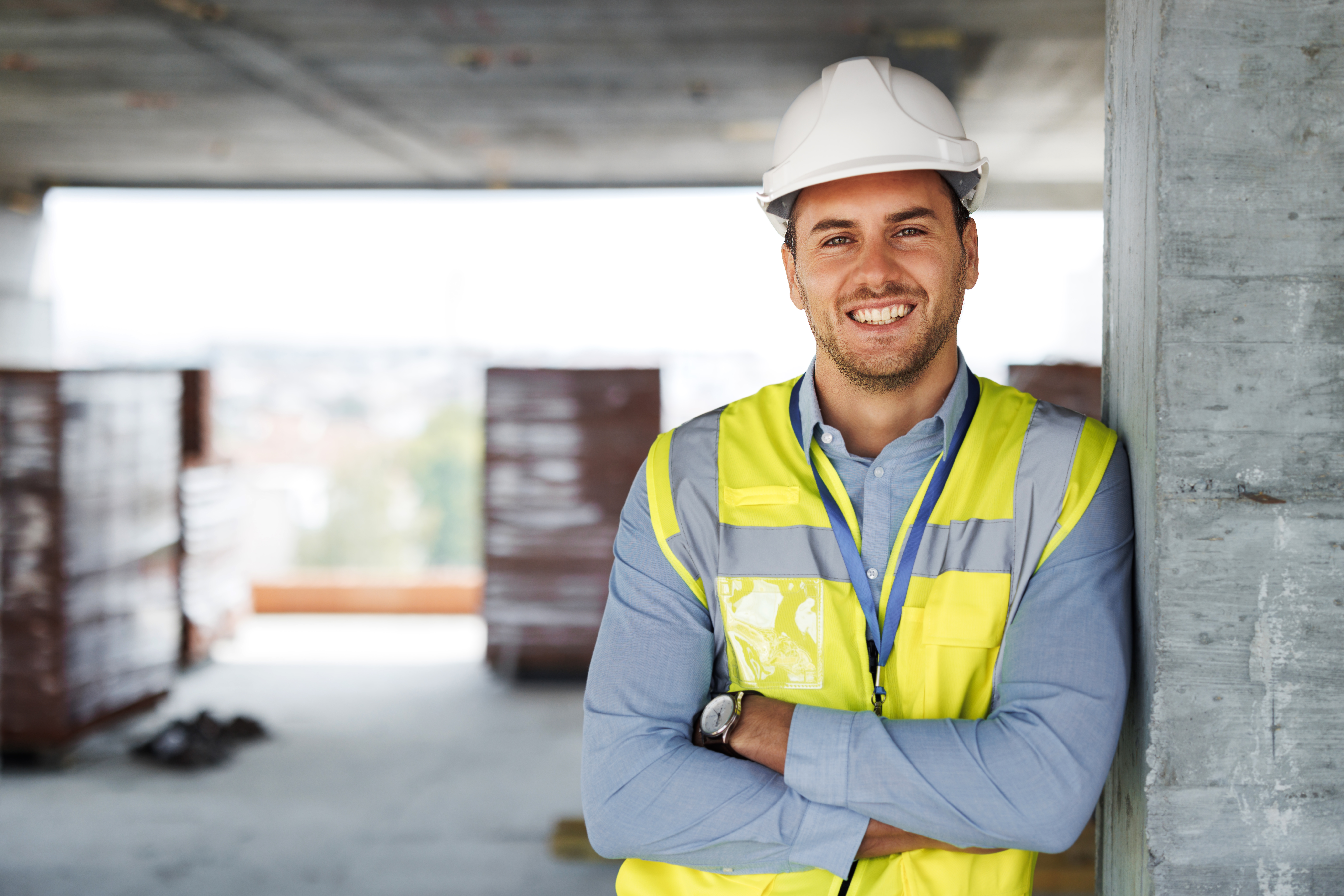 Confident contractor on construction site